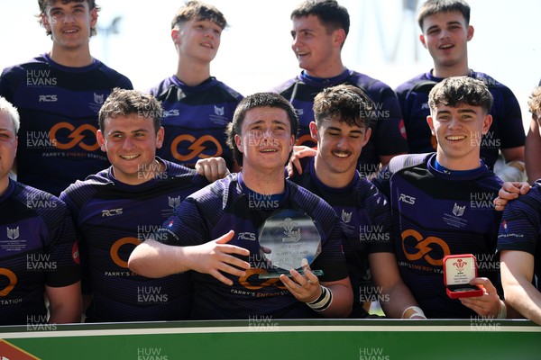 270426 - Crickhowell v Haverfordwest High - Road to Principality Finals - Boys U18s Vase - Haverfordwest players celebrate lifting the vase at full time