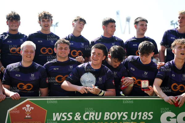270426 - Crickhowell v Haverfordwest High - Road to Principality Finals - Boys U18s Vase - Haverfordwest players celebrate lifting the vase at full time