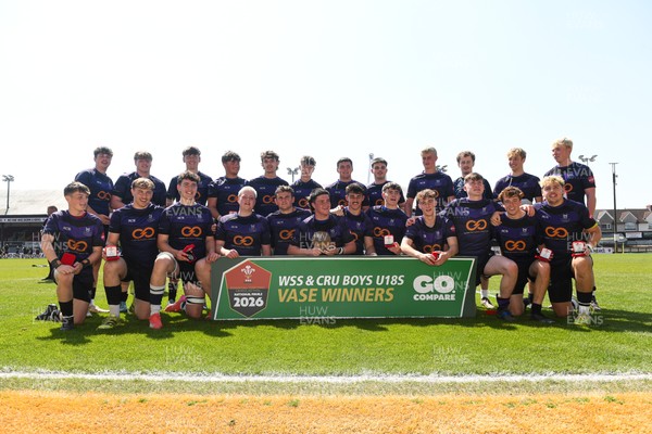 270426 - Crickhowell v Haverfordwest High - Road to Principality Finals - Boys U18s Vase - Haverfordwest players celebrate lifting the vase at full time