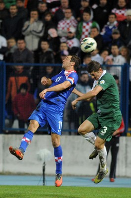 061012 - Croatia v Wales - World Cup QualifierWales' Ben Davies and Croatia's Darijo Srna compete for an aerial ball 
