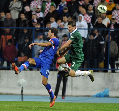 061012 - Croatia v Wales - World Cup QualifierWales' Ben Davies and Croatia's Darijo Srna compete for an aerial ball 