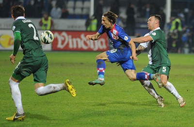 061012 - Croatia v Wales - World Cup QualifierLuka Modric of Croatia is takled by Darcy Blake of Wales  