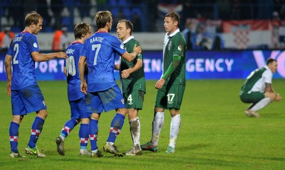 061012 - Croatia v Wales - World Cup QualifierWales' David Vaughan and Simon Church congratulate Croatia's Luka Modric and Ivan Rakitic 