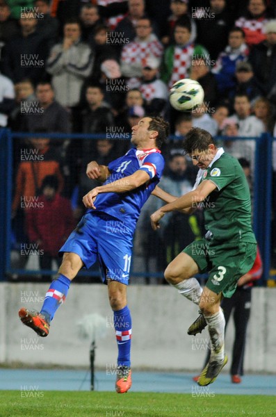 061012 - Croatia v Wales - World Cup QualifierWales' Ben Davies and Croatia's Darijo Srna compete for an aerial ball 