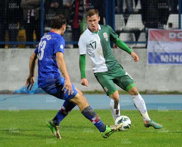 061012 - Croatia v Wales - World Cup QualifierWales' Simon Church is put under pressure by Gordon Schildenfeld of Croatia 