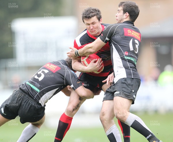 310312  Cross Keys v AberavonAberavons Richard Carter is tackled by Gareth David(l) and Nathan Williams