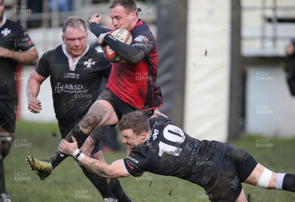 140215 - Cross Keys v Neath, Principality Premiership -Cross Keys Nathan Trowbridge is tackled by Neath's Tom James