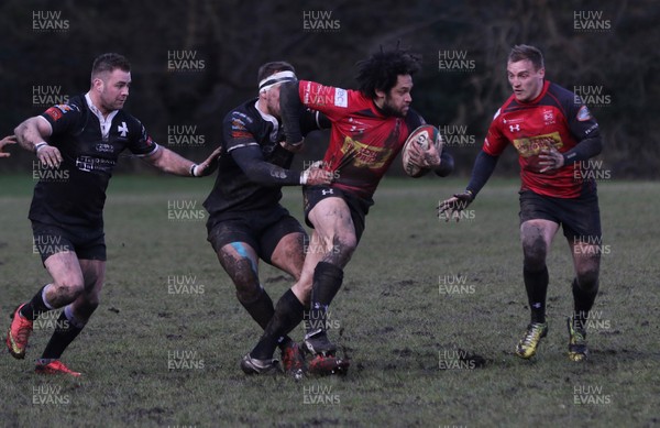 140215 - Cross Keys v Neath, Principality Premiership -Cross Keys Leon Andrews is tackled by Neath's Luke Ford