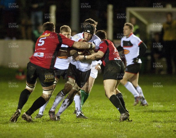 010213 -  Cross Keys v Newcastle Falcons - British and Irish Cup -   Newcastle's Will Welch, centre,  is tackled by Cross Keys Ollie Hodge, left, and Aled James 