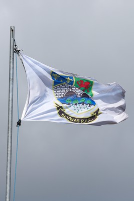 250323 - Cross Keys v Ystrad Rhondda - WRU Championship Cup Semi Final - Bedwas RFC Flag blows in and before todays Semi Final