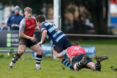 250323 - Cross Keys v Ystrad Rhondda - WRU Championship Cup Semi Final - Tom Lampard of Cross Keys tackles Jarrad Llewellyn of Ystrad Rhondda