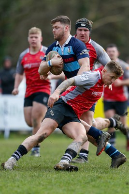 250323 - Cross Keys v Ystrad Rhondda - WRU Championship Cup Semi Final - Kurtis Williams of Ystrad Rhondda breaks through Cross Keys defence