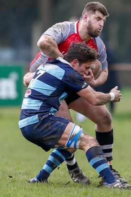 250323 - Cross Keys v Ystrad Rhondda - WRU Championship Cup Semi Final - Jarrad Llewellyn of Ystrad Rhondda tackles Corey Nichols of Cross Keys 