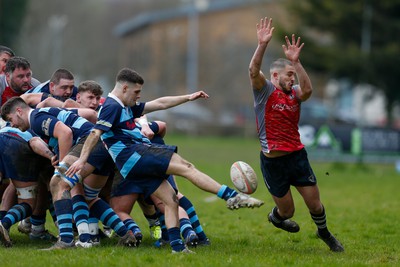 250323 - Cross Keys v Ystrad Rhondda - WRU Championship Cup Semi Final - Callum Phillips of Ystrad Rhondda box kicks under pressure