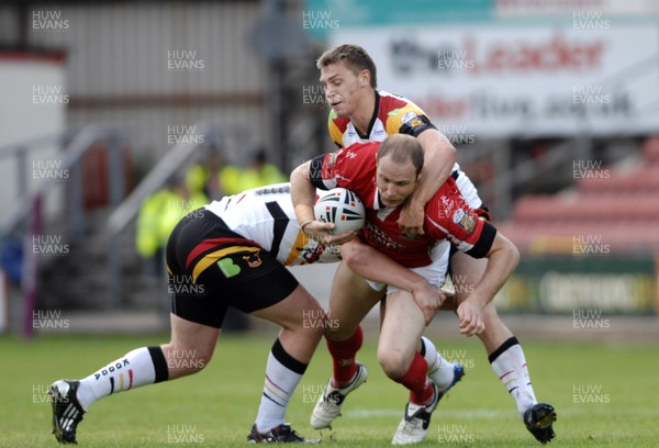 13.06.10 - Crusaders v Bradford- Engage Super League -  Crusaders Adam Peek, centre, is tackled by Bradfords Elliot Whitehead, left, and Steve Crossley 