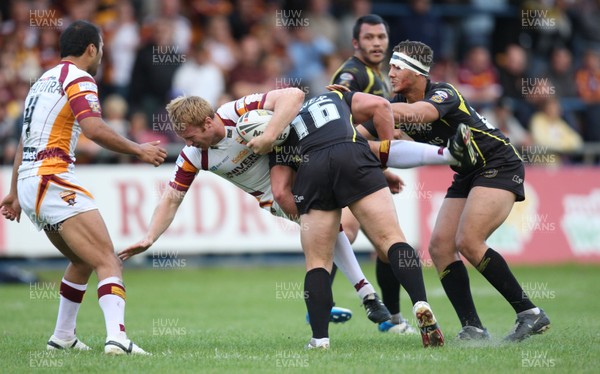 05.09.09 - Celtic Crusaders v Huddersfield Giants, engage Super League -  Huddersfield's David Hodgson is tackled by Crusaders Ben Flower  