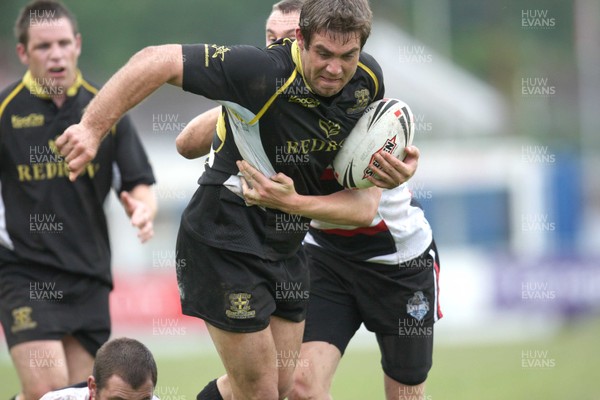 30.06.07.. Celtic Crusaders v York City Knights Crusaders Darren Mapp is held by Knights' Danny Grimshaw 