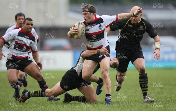 30.06.07.. Celtic Crusaders v York City Knights Knights' James Elston is tackled by Crusaders Terry Martin (lt) and Gareth Dean 