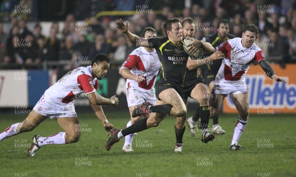 07.03.09 - Celtic Crusaders v St Helens, engage Super League. -  Crusaders Peter Lupton tries to break the St Helens line  