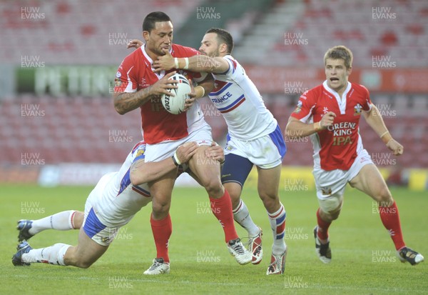 27.06.10 - Crusaders v Wakefield Wildcats - Engage Super League -  Crusaders Weller Hauraki, centre, is tackled by Wakefield's Glenn Morrison, left and Ben Jeffries 