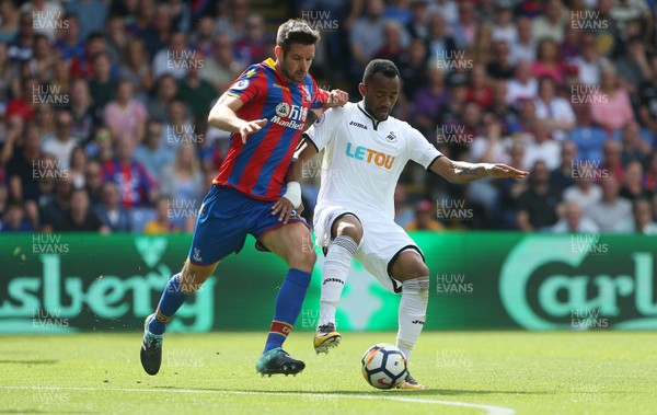 260817 - Crystal Palace v Swansea City - Premier League - Jordan Ayew of Swansea City is tackled by Scott Dann of Crystal Palace