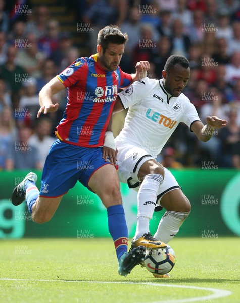 260817 - Crystal Palace v Swansea City - Premier League - Jordan Ayew of Swansea City is tackled by Scott Dann of Crystal Palace