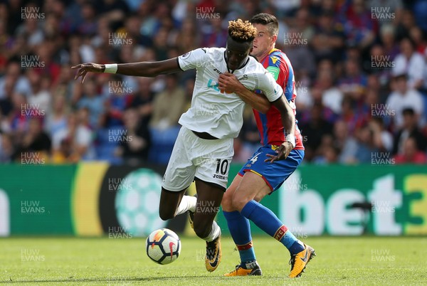 260817 - Crystal Palace v Swansea City - Premier League - Tammy Abraham of Swansea City is tackled by Martin Kelly of Crystal Palace