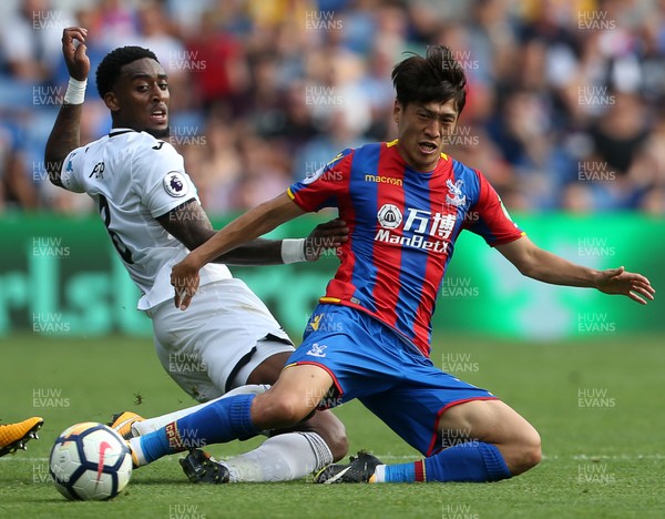 260817 - Crystal Palace v Swansea City - Premier League - Leroy Fer of Swansea City is tackled by Lee Chung-Yong of Crystal Palace
