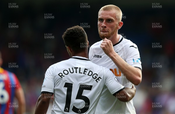 260817 - Crystal Palace v Swansea City - Premier League - Wayne Routledge and Oliver McBurnie of Swansea City celebrate at full time