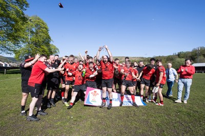 250426 - Cwmafan v Bryncoch, Admiral National League 3 West Central - Captain Ashley Mortimer lifts the trophy alongside team mates