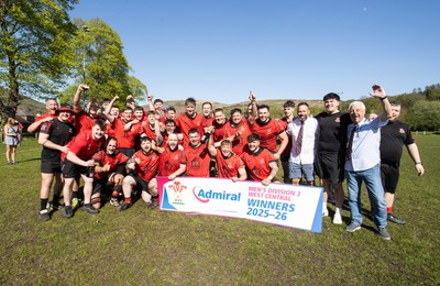 250426 - Cwmafan v Bryncoch, Admiral National League 3 West Central - Captain Ashley Mortimer lifts the trophy alongside team mates