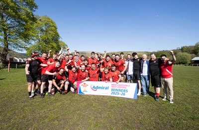 250426 - Cwmafan v Bryncoch, Admiral National League 3 West Central - Captain Ashley Mortimer lifts the trophy alongside team mates