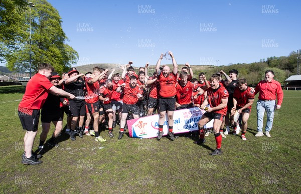 250426 - Cwmafan v Bryncoch, Admiral National League 3 West Central - Captain Ashley Mortimer lifts the trophy alongside team mates