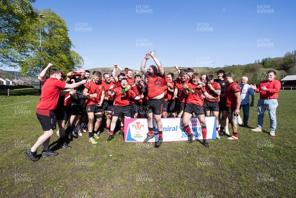 250426 - Cwmafan v Bryncoch, Admiral National League 3 West Central - Captain Ashley Mortimer lifts the trophy alongside team mates
