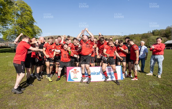 250426 - Cwmafan v Bryncoch, Admiral National League 3 West Central - Captain Ashley Mortimer lifts the trophy alongside team mates