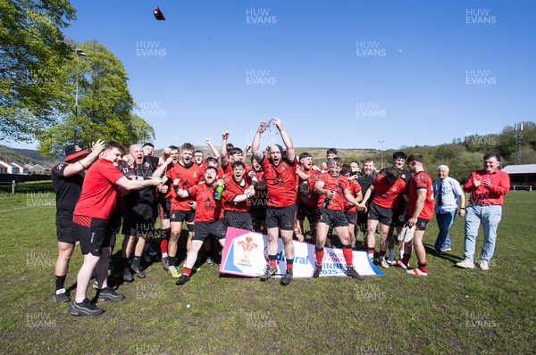 250426 - Cwmafan v Bryncoch, Admiral National League 3 West Central - Captain Ashley Mortimer lifts the trophy alongside team mates