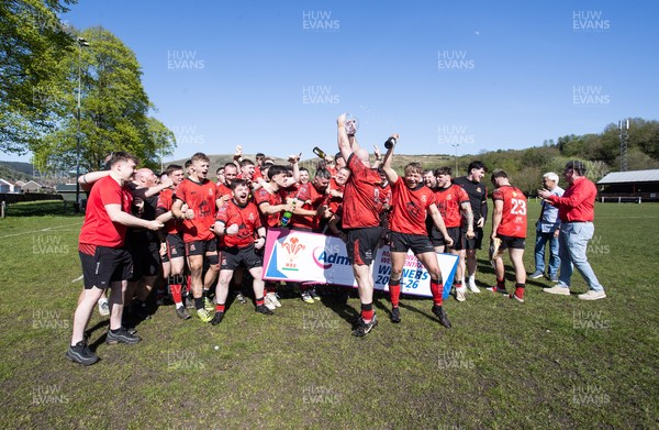 250426 - Cwmafan v Bryncoch, Admiral National League 3 West Central - Captain Ashley Mortimer lifts the trophy alongside team mates