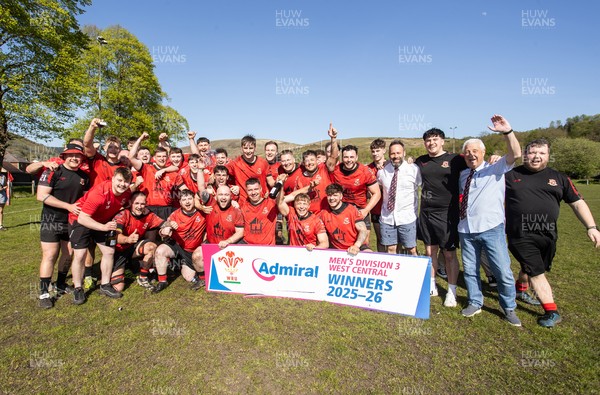 250426 - Cwmafan v Bryncoch, Admiral National League 3 West Central - Captain Ashley Mortimer lifts the trophy alongside team mates