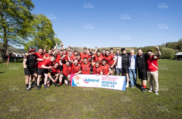 250426 - Cwmafan v Bryncoch, Admiral National League 3 West Central - Captain Ashley Mortimer lifts the trophy alongside team mates