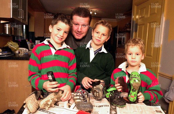 161101 - Dai Young -  Former Welsh rugby captain Dai Young watches as his sons l-r Lewis,Thomas and Owen clean their rugby boots