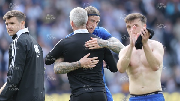 070522 - Derby County v Cardiff City - Sky Bet Championship - Aden Flint of Cardiff hugs Manager Steve Morison of Cardiff at the end of the match