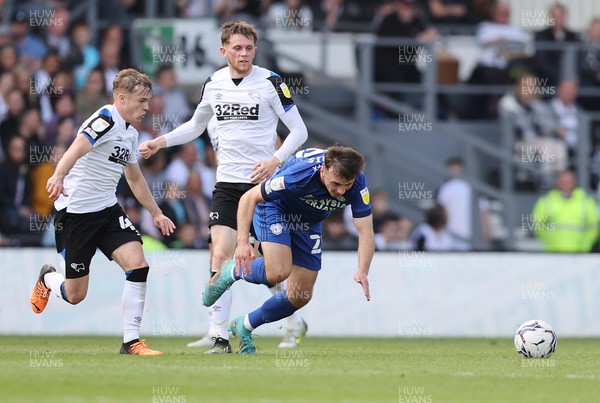 070522 - Derby County v Cardiff City - Sky Bet Championship - Mark Harris of Cardiff races away from Liam Thompson of Derby and Max Bird of Derby