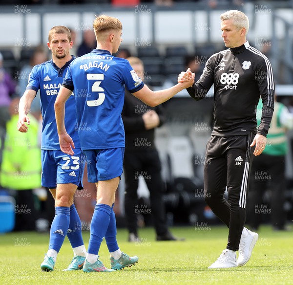 070522 - Derby County v Cardiff City - Sky Bet Championship - Manager Steve Morison of Cardiff with Max Watters of Cardiff at the end of the match and Joel Bagan of Cardiff