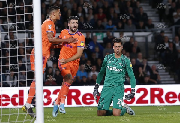 130919 - Derby County v Cardiff City - Sky Bet Championship -  Robert Glatzel of Cardiff celebrates scoring a penalty with Callum Paterson as Kelle Roos of Derby looks on