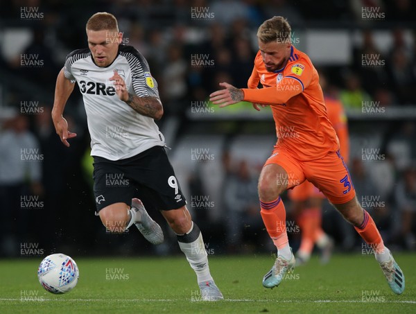 130919 - Derby County v Cardiff City - Sky Bet Championship -  Martyn Waghorn of Derby tries to escape the oncoming Joe Bennett of Cardiff