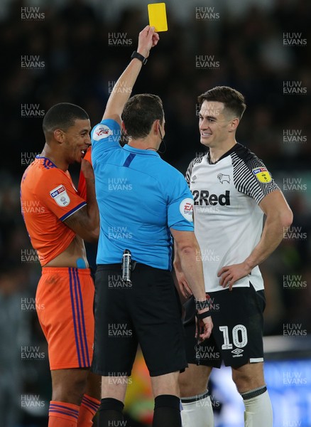 130919 - Derby County v Cardiff City - Sky Bet Championship -  Tom Laurence of Derby is given a yellow card by referee Darren England in the 2nd half