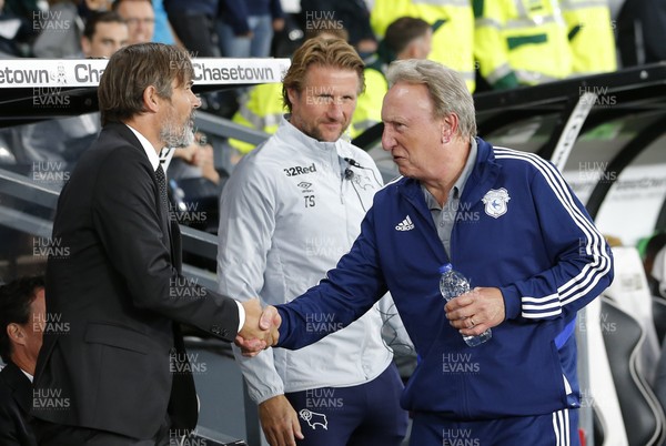 130919 - Derby County v Cardiff City - Sky Bet Championship -  Derby Manager Phillip Cocu greets Manager Neil Warnock of Cardiff before the start of the match