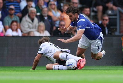 220826 - Derby County v Cardiff City, EFL Sky Bet Championship - Ollie Tanner of Cardiff City is brought down by Charlie Taylor of Derby County