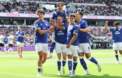 220826 - Derby County v Cardiff City, EFL Sky Bet Championship - Cian Ashford of Cardiff City celebrates on the shoulders of Jack Moylan of Cardiff City after scoring the first goal