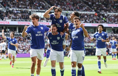 220826 - Derby County v Cardiff City, EFL Sky Bet Championship - Cian Ashford of Cardiff City celebrates on the shoulders of Jack Moylan of Cardiff City after scoring the first goal